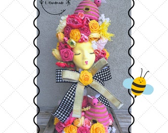 Spring floral bumblebee centerpiece, mannequin head floral arrangement