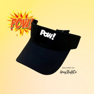 May include: Black visor with a white "Pow!" logo on the front. Designed by UniqStuffCo.