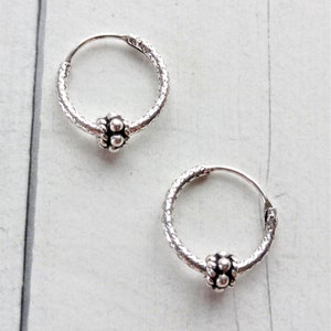 Snakeskin hoop earring with Vintage Charm made in Sterling Silver