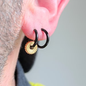 Black enameled Sterling Silver hoop earring with gold charm · sun and shadow