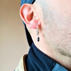 Sterlingzilveren oorbel met jet-beschermingsbedel · Zilveren oorring met figa-amulet · Lucky Charm-oorbel