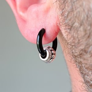 Black 316 L stainless steel hoop earring with pirate style charm · Extra wide 14 mm pirate hoop for men