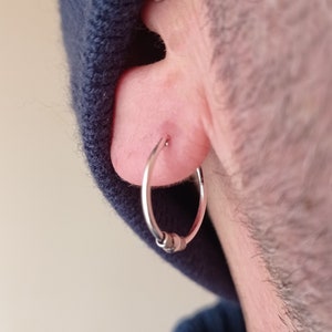 Sterling Silver hoop earring with sphere and knots · 16mm
