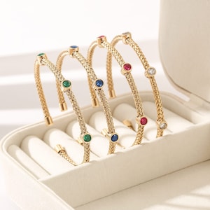 Pulsera cz flex tejida en oro de acero inoxidable