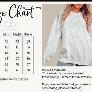 May include: A light gray unisex sweatshirt with a size chart. The chart shows measurements in inches for sizes S to 3XL. The sweatshirt is not oversized, and the text advises sizing up for a looser fit.