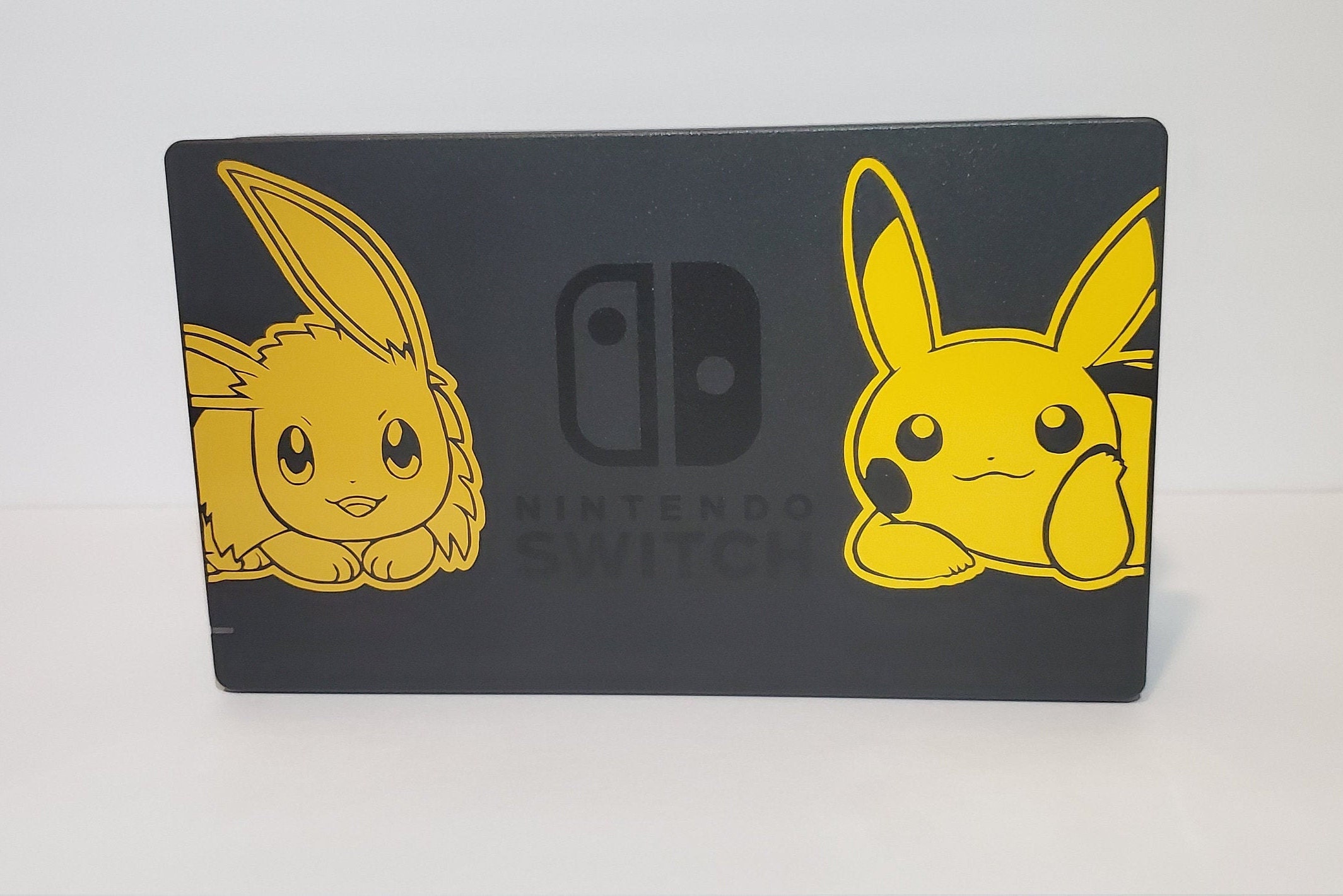 I've never been able to afford a Pokemon-themed Switch, so I decided I make  my own :D It's just a vinyl sticker that I cut and coloured in some black  parts, the