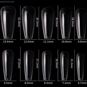 May include: Ten clear plastic nail tips in various sizes, ranging from 6.7 mm to 13.4 mm in width and 25.3 mm to 31.9 mm in length. The nail tips are arranged in two rows of five, with the measurements labeled below each tip.