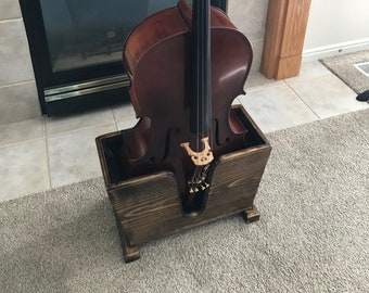 Duggh 4/4 Cello Stand. Finished stained wood with soft cushion lining and fitted to the full sized cello.