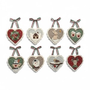 May include: Eight heart-shaped felt ornaments with scalloped edges and plaid ribbon hangers. Designs include a wreath, a house in snow, a rabbit, mittens, a mug, a snowman, a bird on a branch, and a reindeer, all featuring intricate embroidery.