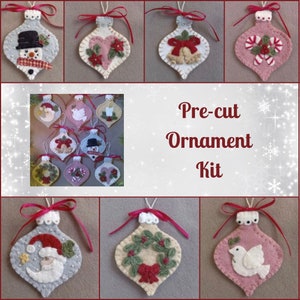May include: A pre-cut felt ornament kit with nine different designs. The ornaments feature a variety of Christmas themes, including a snowman, a heart, a dove, a wreath, and a candy cane. The kit includes all the felt pieces needed to make the ornaments, as well as instructions.