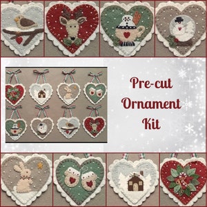 May include: A pre-cut felt ornament kit with 10 different heart-shaped ornaments. The ornaments feature various winter themes, including a snowman, a deer, a bird, a house, and a bunny. The kit includes all the felt pieces needed to make the ornaments, as well as instructions.