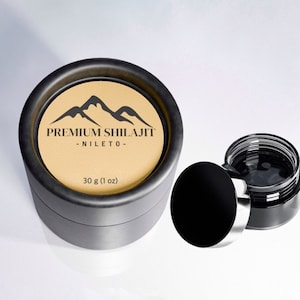 May include: A black jar with a black lid and a brown label that says "Premium Shilajit - Nileto - 30 g (1 oz)". The jar is sitting on a white surface.