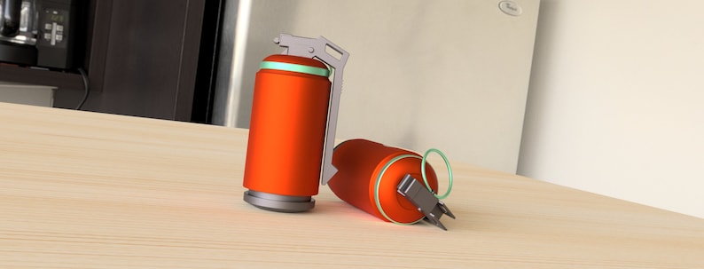 May include: Two orange and gray smoke grenades with a green ring around the top. The grenades are on a light brown wooden surface.