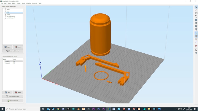 May include: A 3D printed model of a cylindrical object and a frame with multiple parts. The model is orange and is displayed on a gray grid.