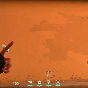 May include: A first-person view of a video game, showing a player's hand holding a grenade. The player is aiming the grenade at a wall. The wall is a bright orange color. The text "BAS VE KARAKTER DEGISTIR" is visible in the lower left corner of the image.