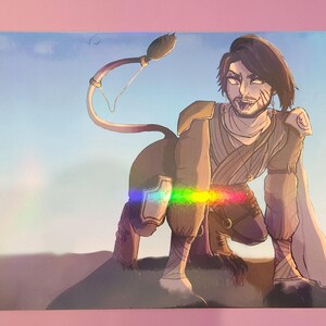 May include: Illustration of a humanoid creature with a lion's tail, wearing tan and brown clothing. The artwork has a holographic effect, with a rainbow sheen across the image. The background is a gradient of blue and tan.