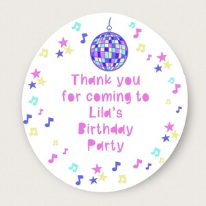 May include: Round white thank you sticker with a pink, blue, and yellow disco ball, stars, and musical notes. The text reads "Thank you for coming to Lila's Birthday Party".
