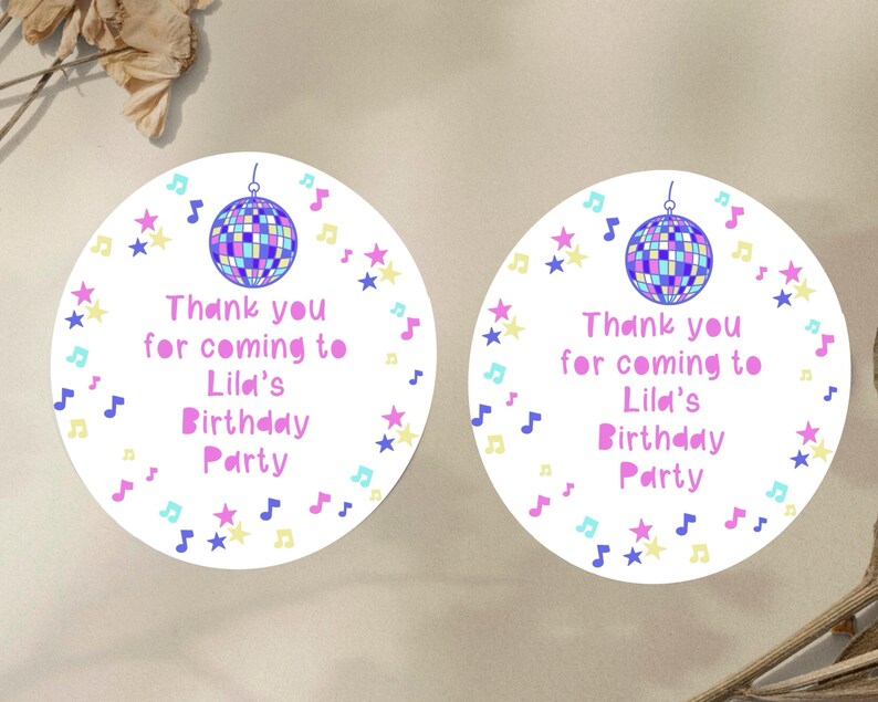 May include: Two round white thank you stickers with a pink disco ball, stars, and musical notes. The text on the stickers reads "Thank you for coming to Lila's Birthday Party".