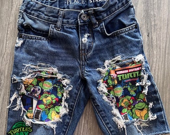 Distressed character fabric shorts or jeans