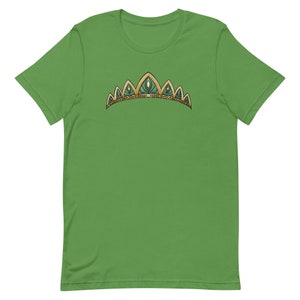 May include: A green t-shirt with a gold and green crown design.