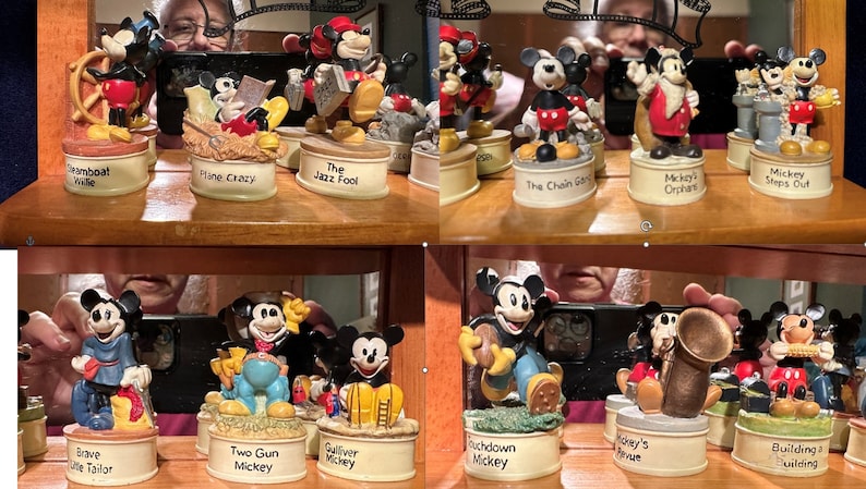 May include: A collection of 10 small, hand-painted ceramic figurines of Mickey Mouse in various poses and settings. Each figurine is on a round base with a different inscription, such as "Steamboat Willie", "Piano Crazy", "The Jazz Fool", "The Chain Gang", "Mickey's Orchestra", "Mickey Steps Out", "Brave Little Tailor", "Two Gun Mickey", "Gulliver Mickey", "Touchdown Mickey", "Mickey's Avenue", and "Building a Building".