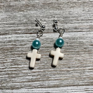 Pearl cross dangle earrings