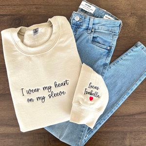 I Wear My Heart On My Sleeve, Embroidered Custom Mama Shirt With Kids Names, Pregnancy Reveal Hoodie Gift For New Mom, Mother's Day Gift