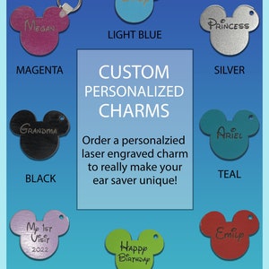 May include: A variety of personalized Mickey Mouse ear saver charms in different colors, including light blue, magenta, black, teal, lavender, lemongrass, and red. The charms are engraved with names, phrases, and designs.