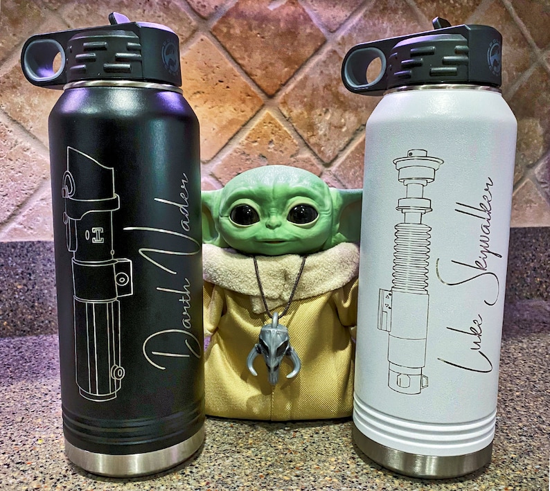32oz Star Wars Lightsaber Water Bottles. These are laser engraved  with your favorite Jedi Lightsaber and signature like Darth Vader, Luke Skywalker, Obi-Wan Kenobi, Kylo Ren, Ahsoka Tano, and more! These can also be personalized.