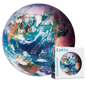 May include: A 3D globe puzzle of Earth with a blue and green color scheme. The puzzle is in a box with the word "EARTH" and "ANTELOPE PUZZLE" printed on it.