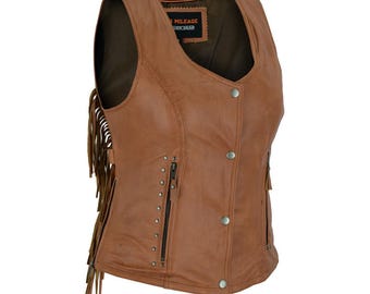 May include: A brown leather vest with fringe detailing on the sides. The vest has a zipper closure and a snap button closure. The vest has a label that says "High Mileage Leather Wear".