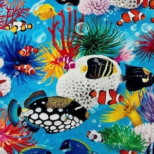 May include: A vibrant, detailed illustration of an underwater scene. The image features a variety of colorful fish, including clownfish, and other marine life, such as coral and starfish, set against a bright blue background. The artwork has a whimsical, cartoon-like style.