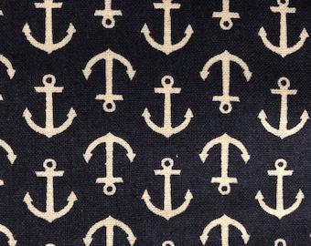 May include: A navy blue fabric with a white anchor pattern. The anchors are repeated in a grid pattern.