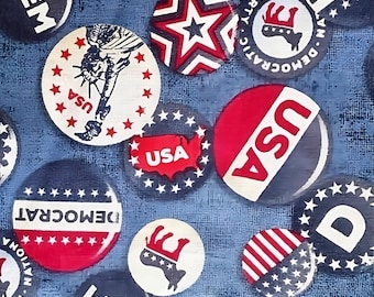 May include: A blue fabric background with various red, white, and blue buttons. The buttons feature stars, the words "USA", "DEM", "DEMOCRAT", and "DEMOCRATIC PARTY".