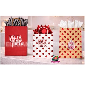 May include: Three gift bags with the text "Delta Sigma Theta". One red bag with black and white striped ribbon, a white bag with red polka dots, and a tan bag with red polka dots and a crest.
