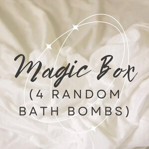 May include: A white background with a white and gray design of stars and circles. The text "Magic Box (4 RANDOM BATH BOMBS)" is written in black.