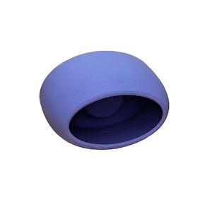 May include: A light purple ceramic planter with a rounded shape and a wide opening. The planter is ideal for small plants or succulents.