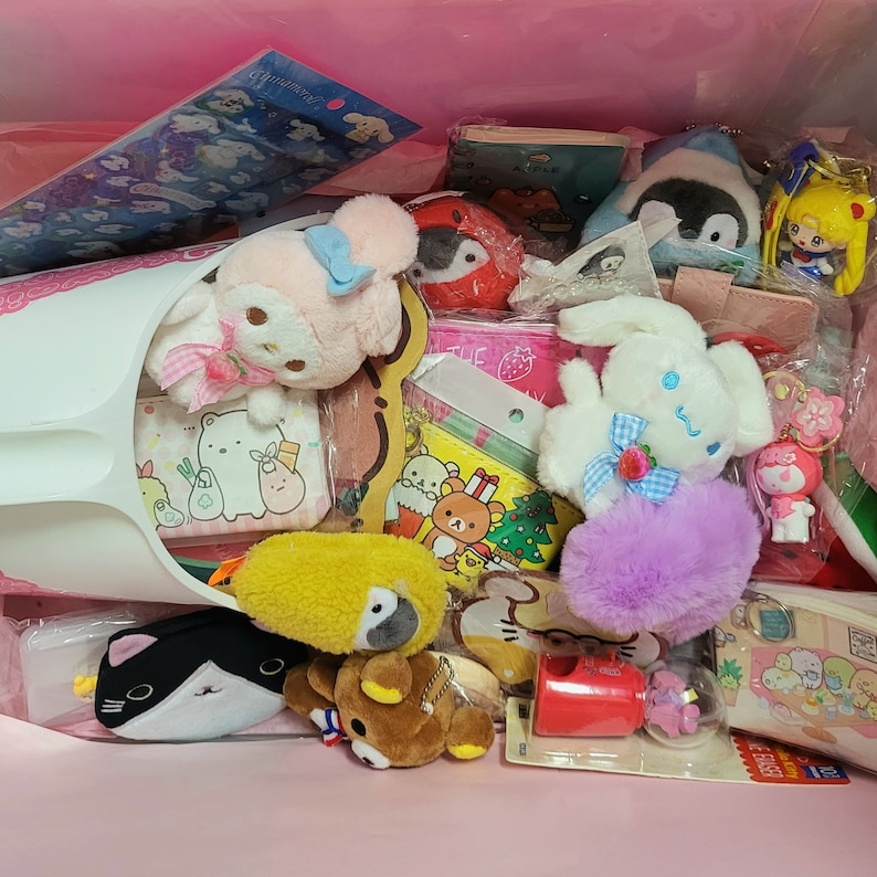 May include: A pink bag filled with various colorful plush toys, including a penguin, a bunny, a bear, and a cat. There are also several small items, such as stickers, keychains, and a small notebook.