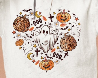 May include: White sweatshirt with a heart-shaped design featuring a ghost, pumpkins, bats, stars, and the text "BOO".