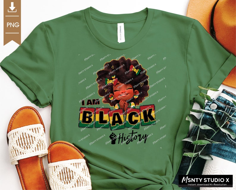 K&ouml;nnte beinhalten: Gr&uuml;nes T-Shirt mit einer schwarzen und braunen Illustration eines M&auml;dchens mit Afro und dem Text "I Am Black History".