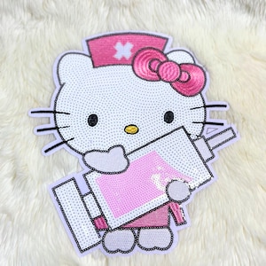May include: A white sequined patch depicting a cartoon cat in a pink nurse's cap and bow, holding a pink sequined syringe. The cat has black whiskers, eyes, and a yellow nose. The patch is outlined in black.