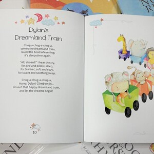 May include: A children's book titled "Dylan's Dreamland Train" with colourful illustrations of animals riding a train. The text reads "Chug-a-chug-a-chug-a, comes the dreamland train, round the bend of evening, it's sleepytime again."