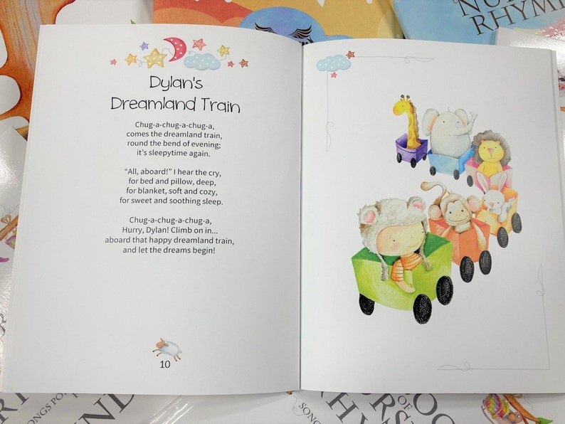 May include: A children's book titled "Dylan's Dreamland Train" with colourful illustrations of animals riding a train. The text reads "Chug-a-chug-a-chug-a, comes the dreamland train, round the bend of evening, it's sleepytime again."