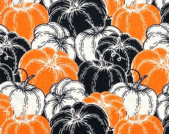 Halloween fabric -- Orange, black, and white pumpkins repeated -- 100% cotton quilting fabric
