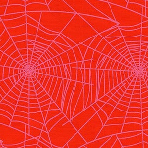 Halloween fabric -- Pink spider webs repeated on coral/salmon red -- 100% cotton quilting fabric