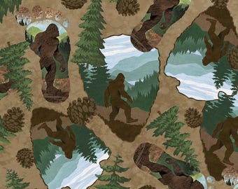Scattered Bigfoots in footprints and arrowhead cutouts with trees and pine cones on mottled brown -- 100% cotton quilting fabric