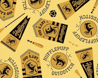 HARRY POTTER fabric -- Hufflepuff house banners and quidditch gear scattered on yellow -- 100% cotton quilting fabric