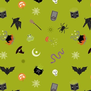 Halloween fabric -- Witchy items on acid green with metallic silver highlights -- Cauldrons, bats, skulls -- 100% cotton quilting fabric