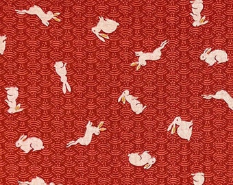 Tissu japonais -- Lapins naturels sautillant sur un fond rouge à motifs -- Tissu matelassé 100 % coton