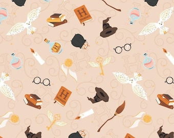 HARRY POTTER fabric -- Magical tools from the Harry Potter series on pale, light orange -- 100% cotton quilting fabric